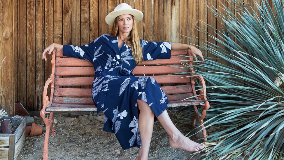 Woman on bench wearing La Sirena robe by California Cowboy