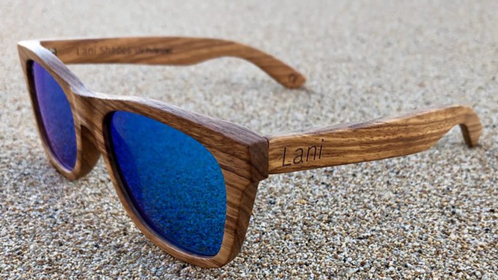 A pair of Lani shades in the sand
